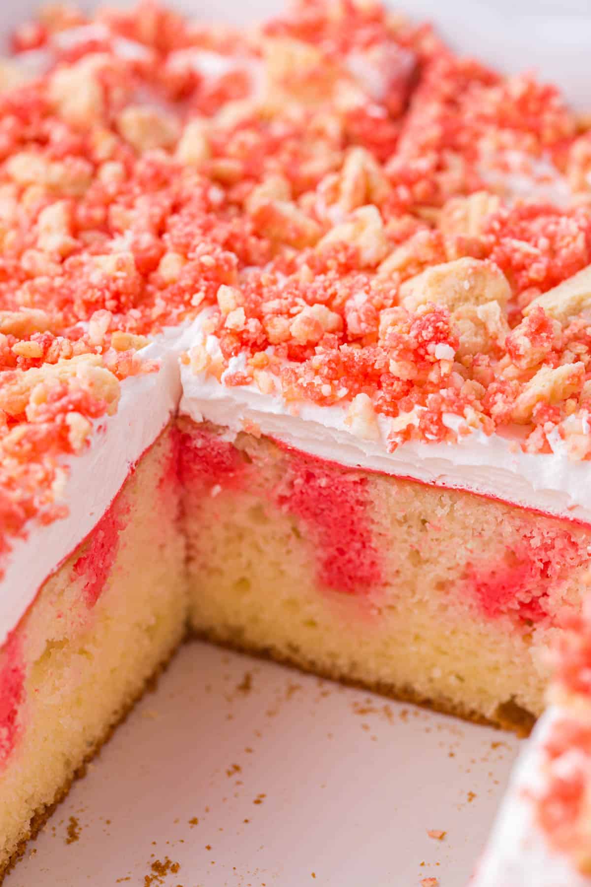strawberry crunch poke cake in a baking pan