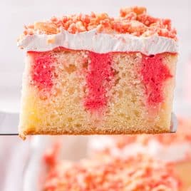 a piece of strawberry crunch poke cake on a spatula