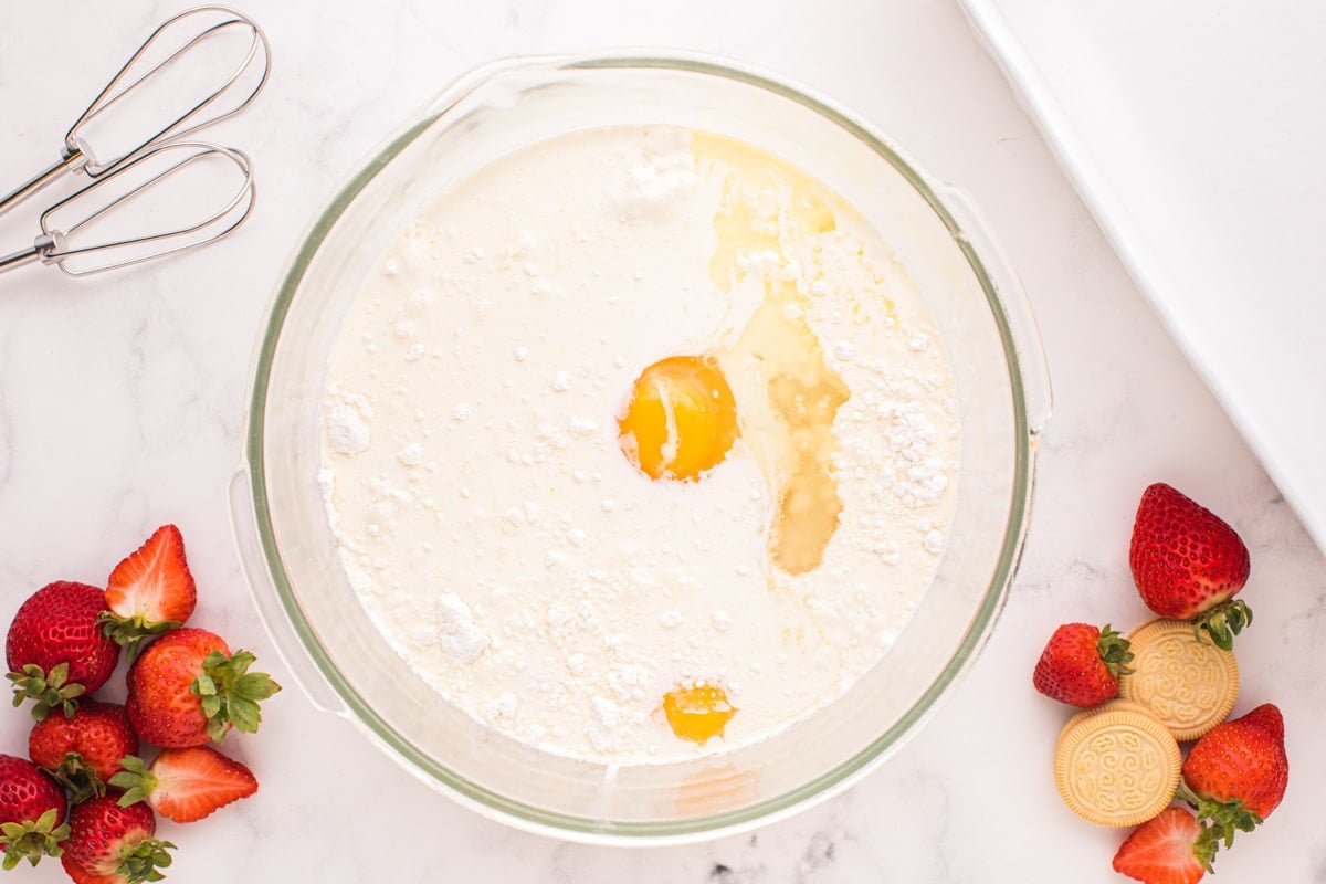 cream, cake mix, eggs and oil in a mixing bowl