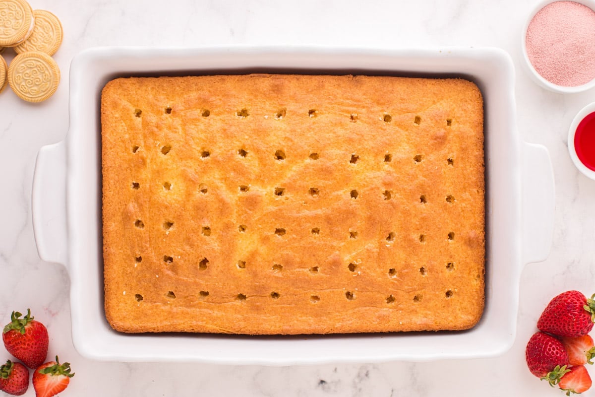 a baked cake with holes poked all over the top
