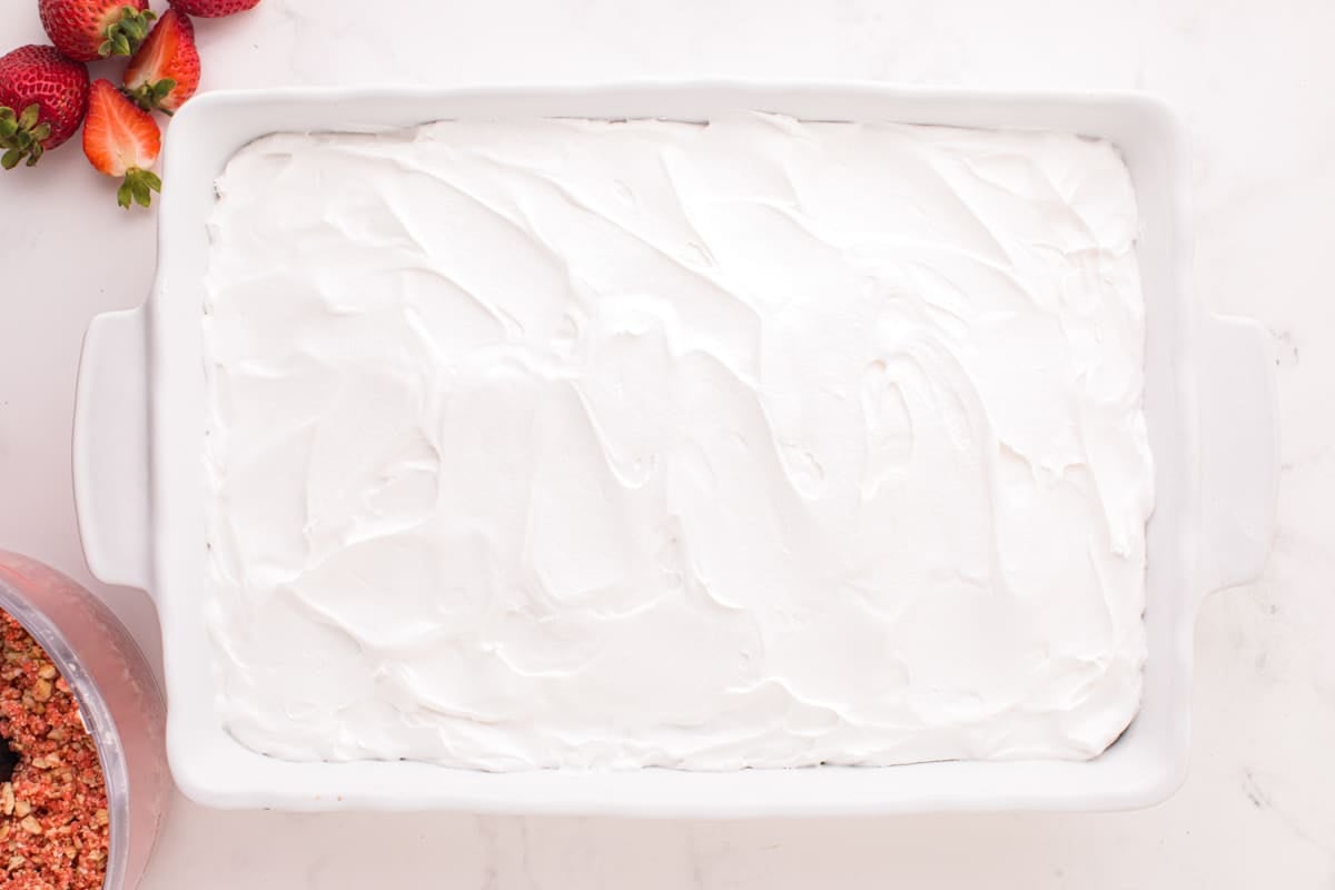cake in a 9x13" pan frosted with cool whip