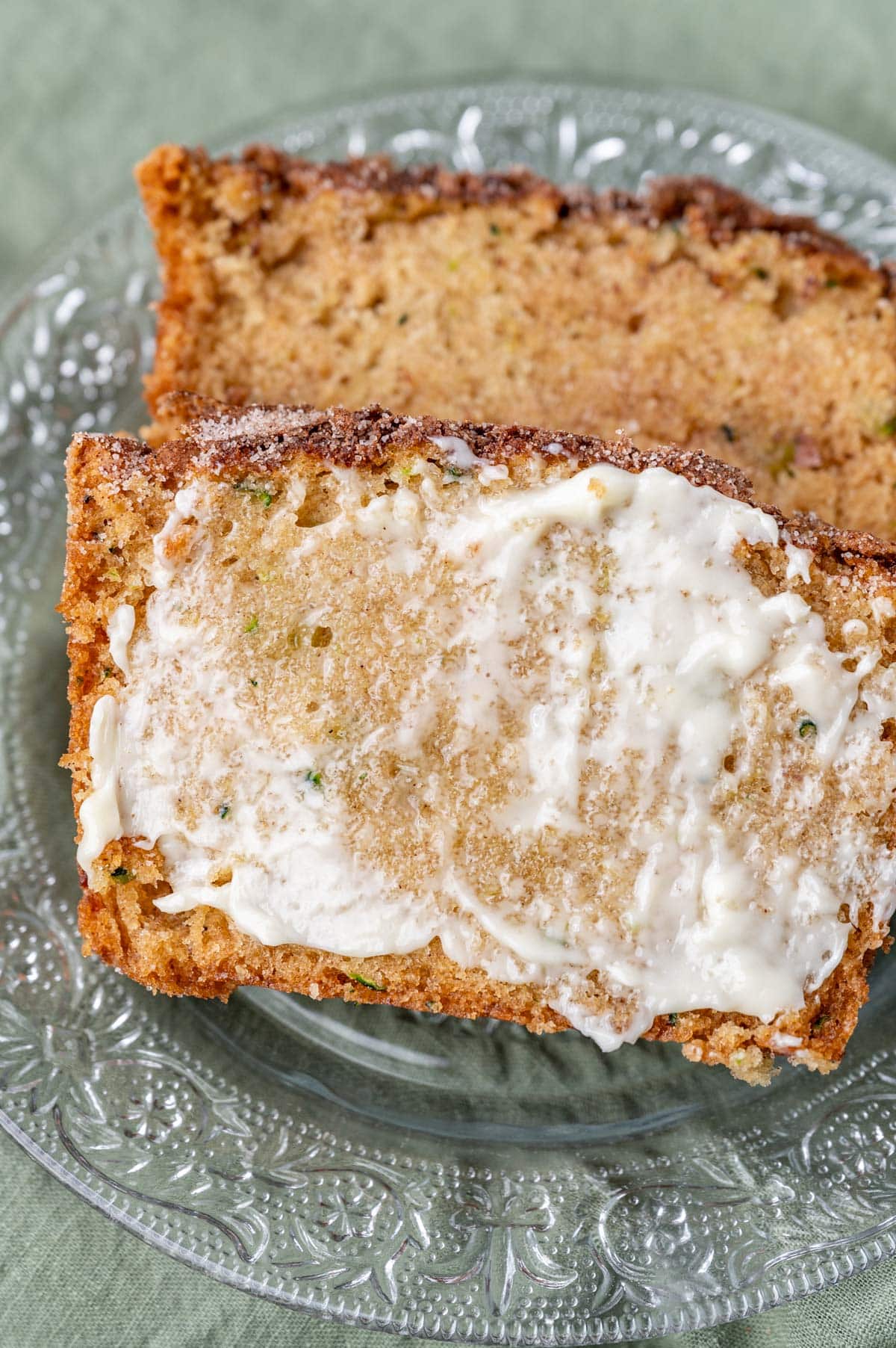 two pieces of zucchini bread with butter