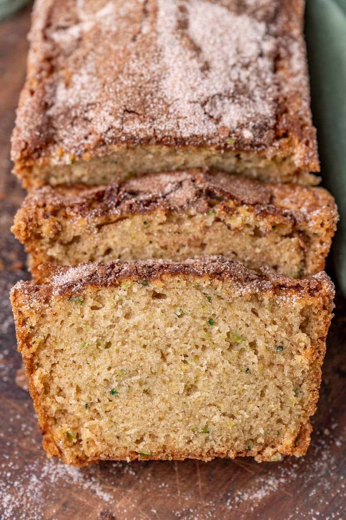 a loaf of zucchini bread with two slices cut