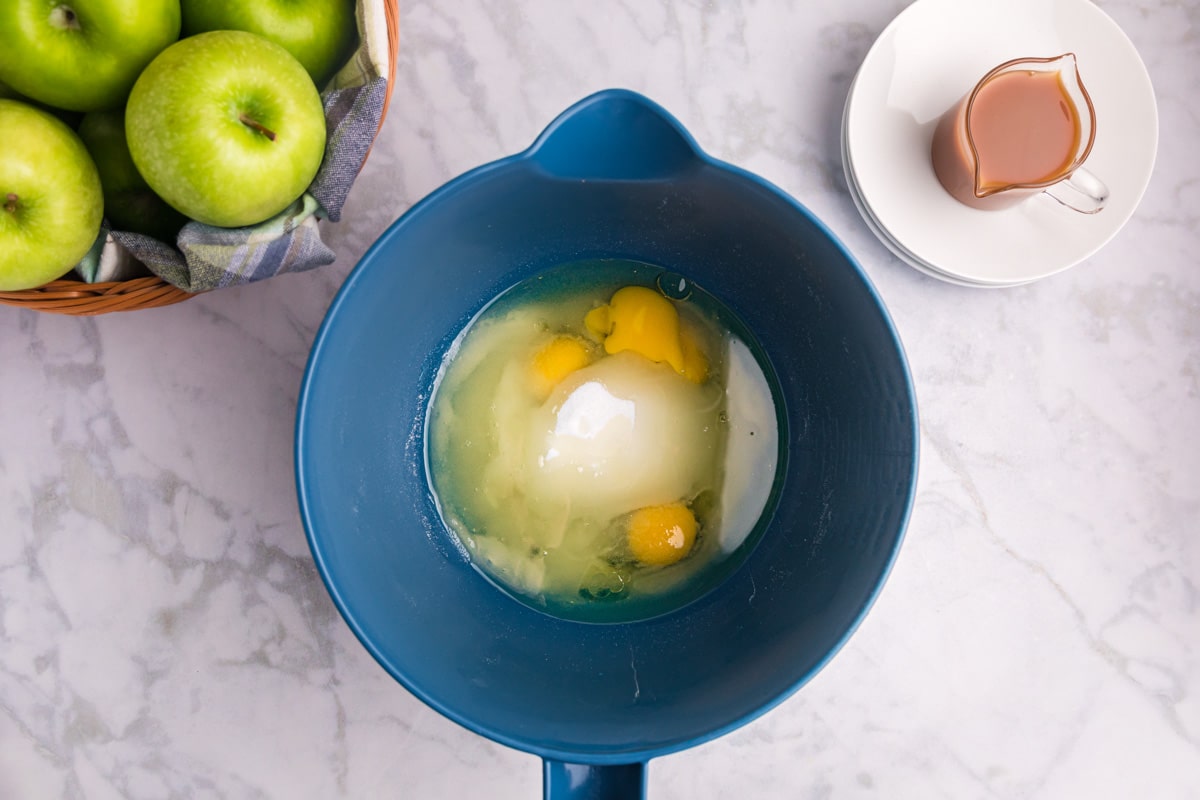 wet ingredients for cake in a blue bowl