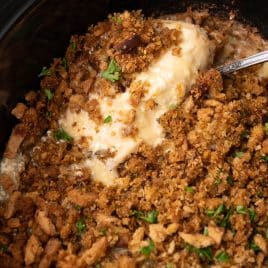 closeup of chicken and stuffing in a slow cooker
