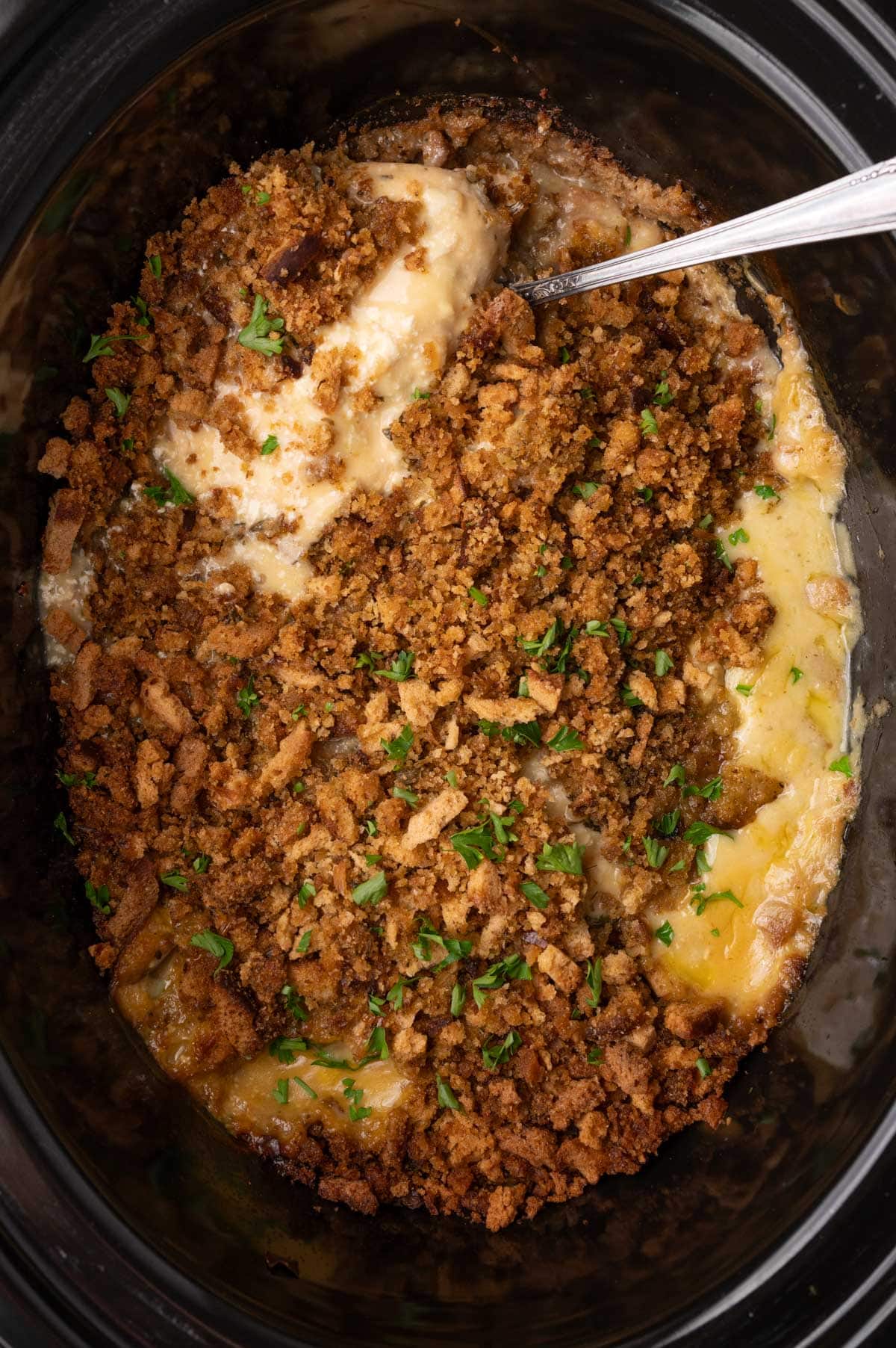 crockpot chicken and stuffing with a spoon