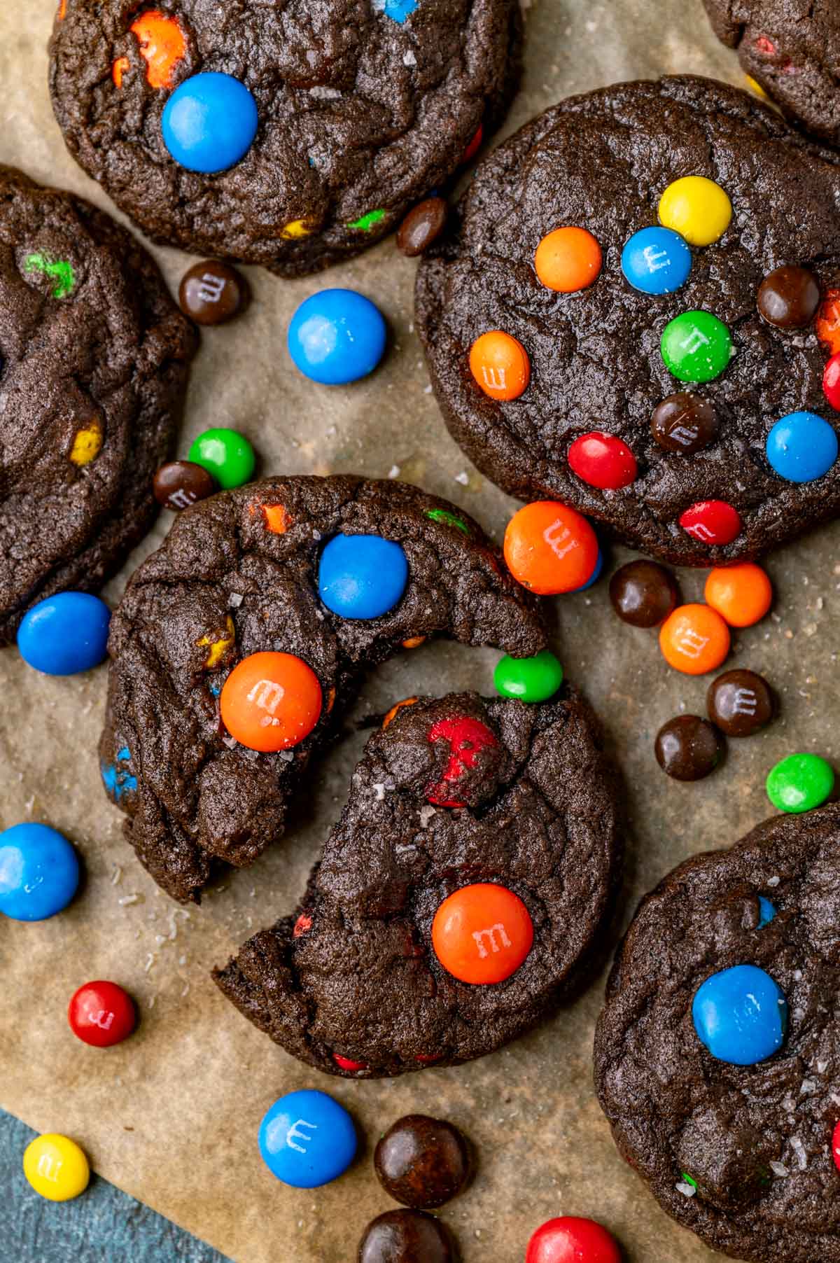 chocolate M&M cookies on parchment paper