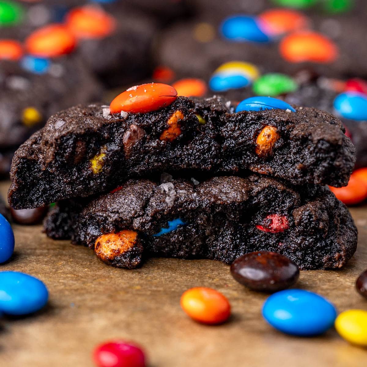 a fudgy chocolate M&M cookie cut in half