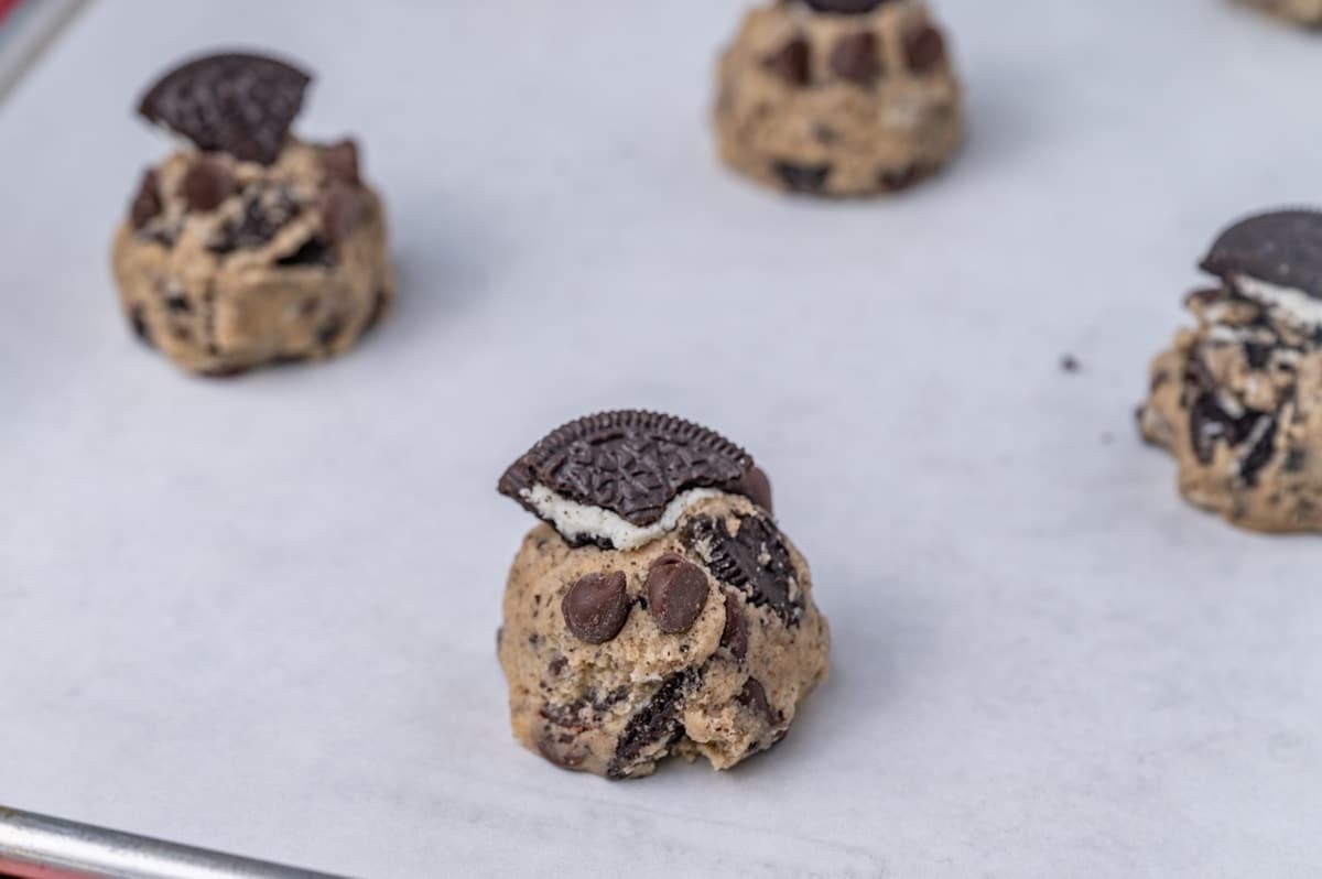 unbaked oreo cookies on a baking sheet