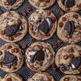 oreo chocolate chip cookies lined up on a baking sheet