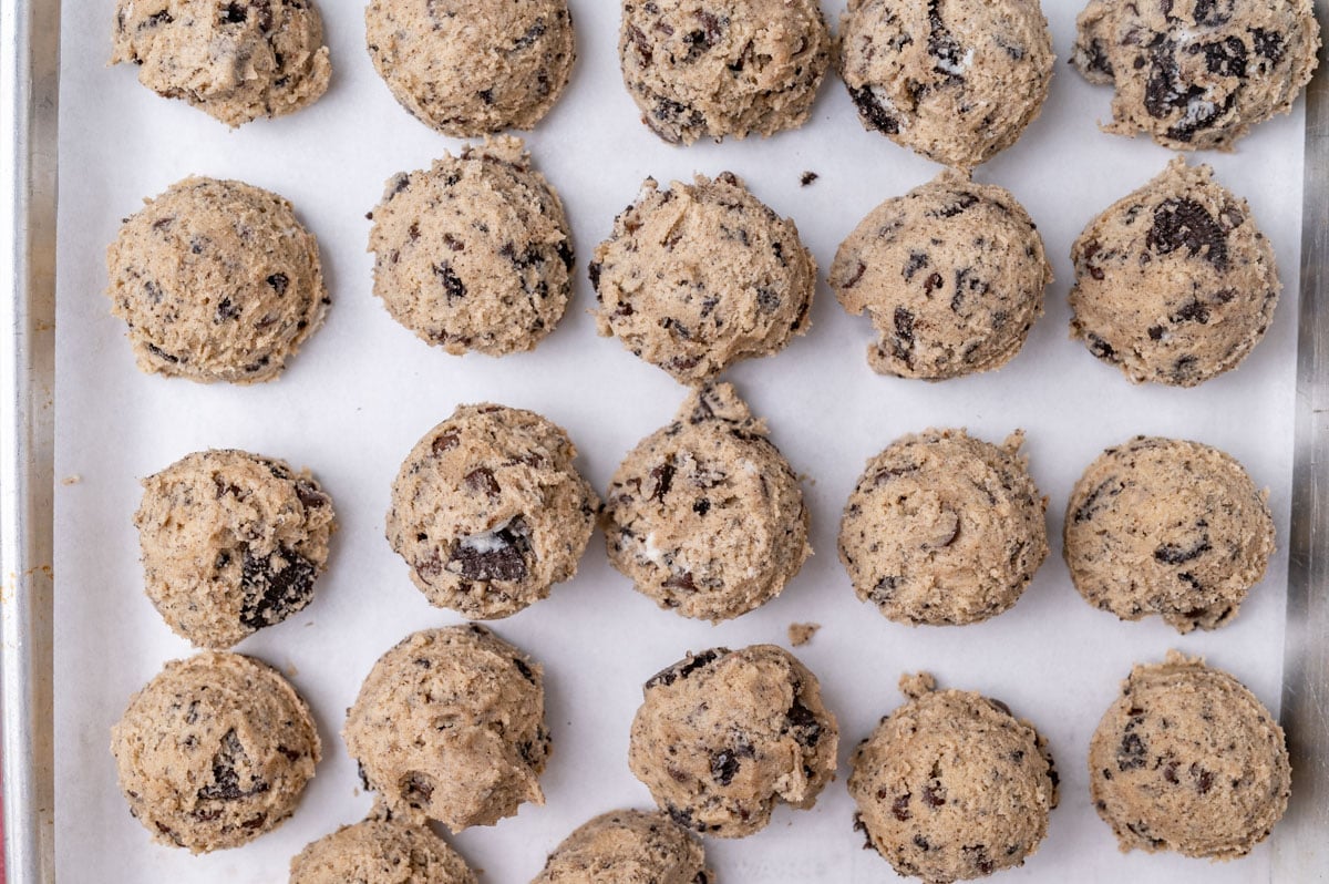 oreo cookie dough balls on a baking sheet