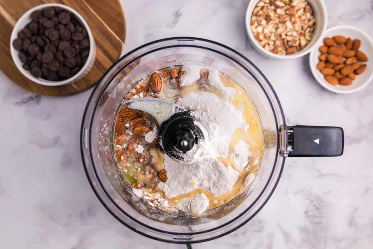 ingredients for almond crust in a food processor