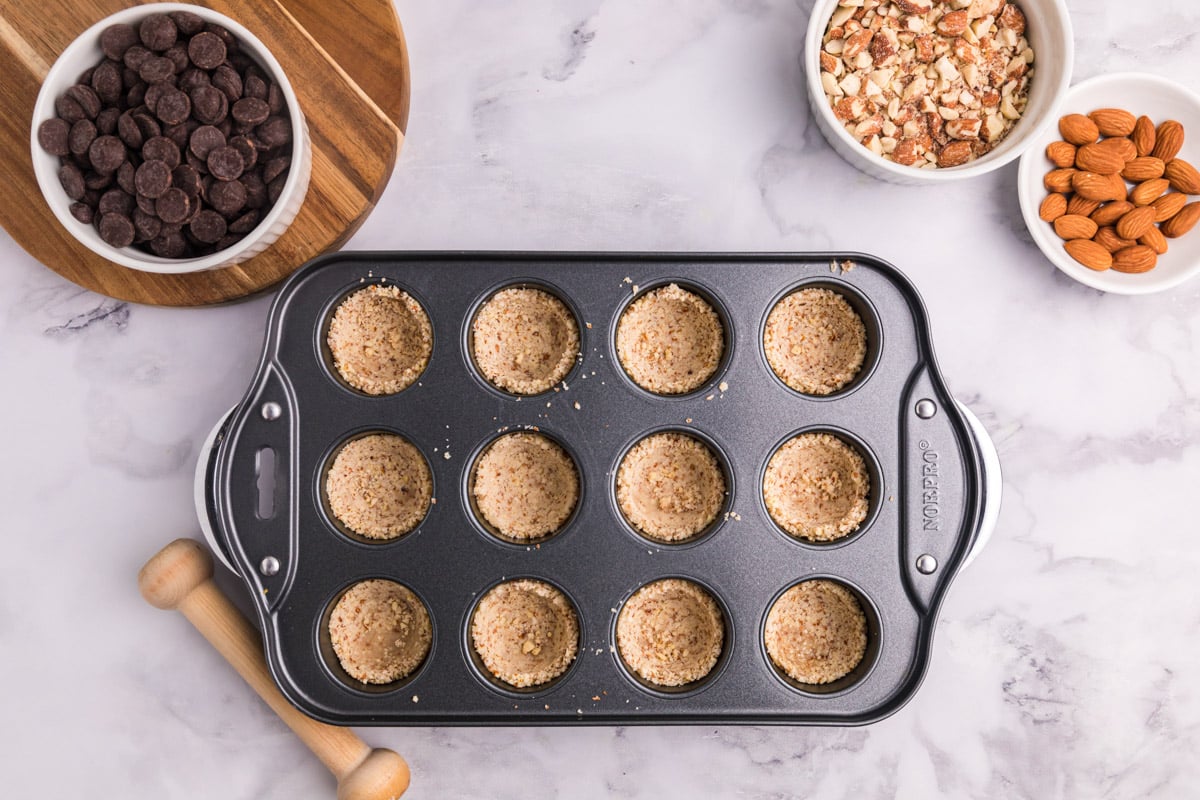 crusts pressed into a mini cheesecake pan