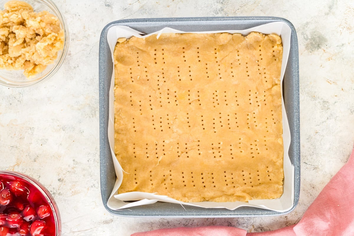 shortbread crust pressed into an 8x8" baking pan lined with parchment paper