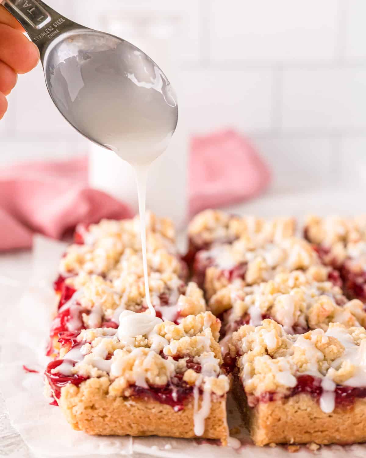 tablespoon drizzling glaze over cherry bars