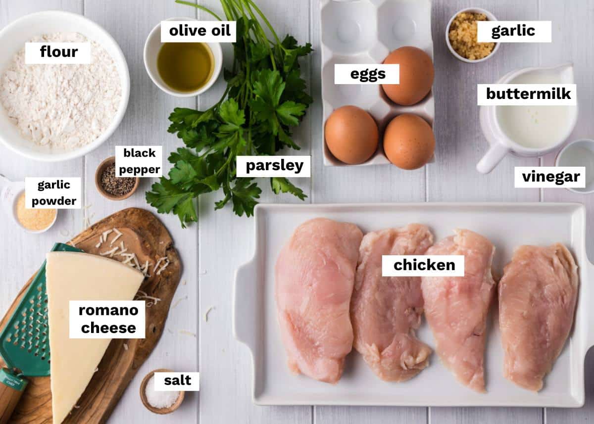a table with ingredients for chicken romano