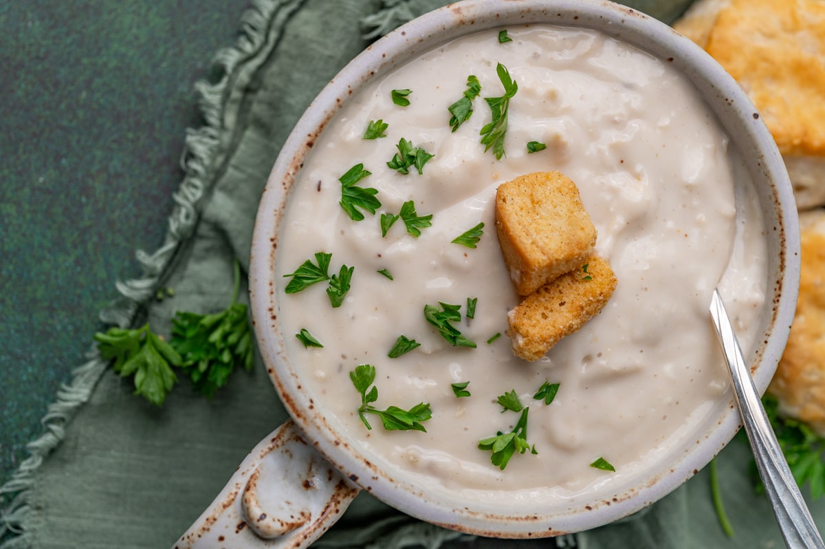 overhead view of a bowl of soup with croutons