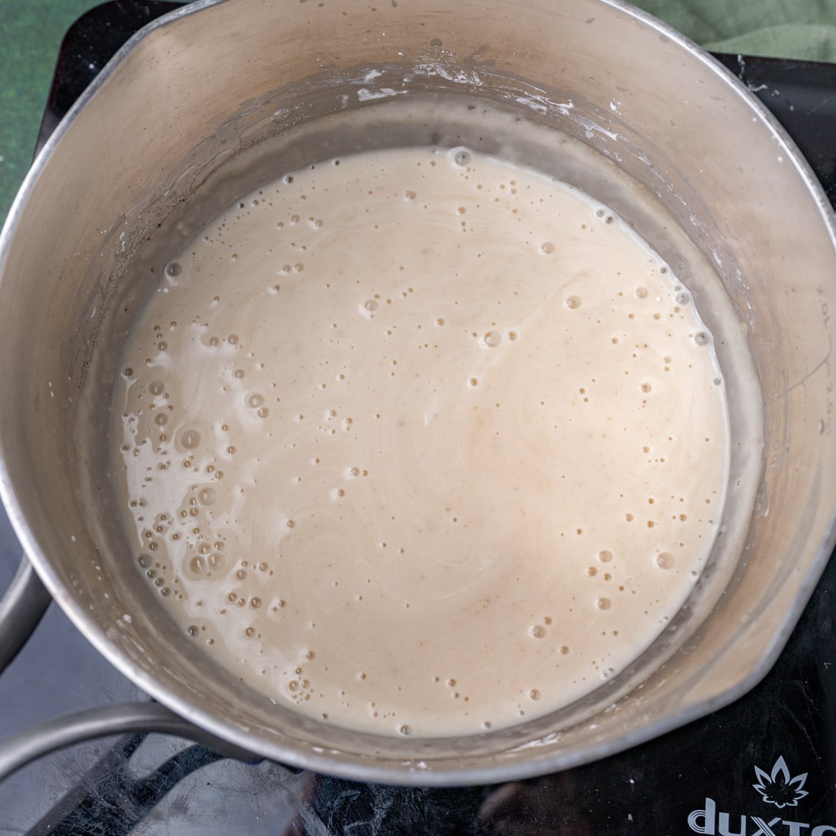 homemade cream of chicken soup in a saucepan