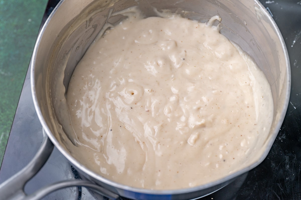 a pan with homemade cream of chicken soup in it