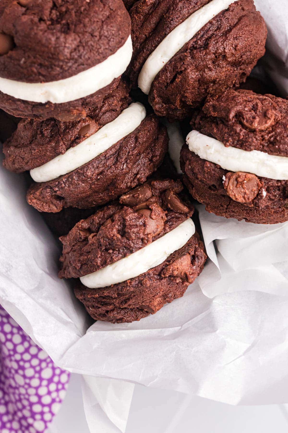 overhead view of chocolate sandwich cookies in a tin