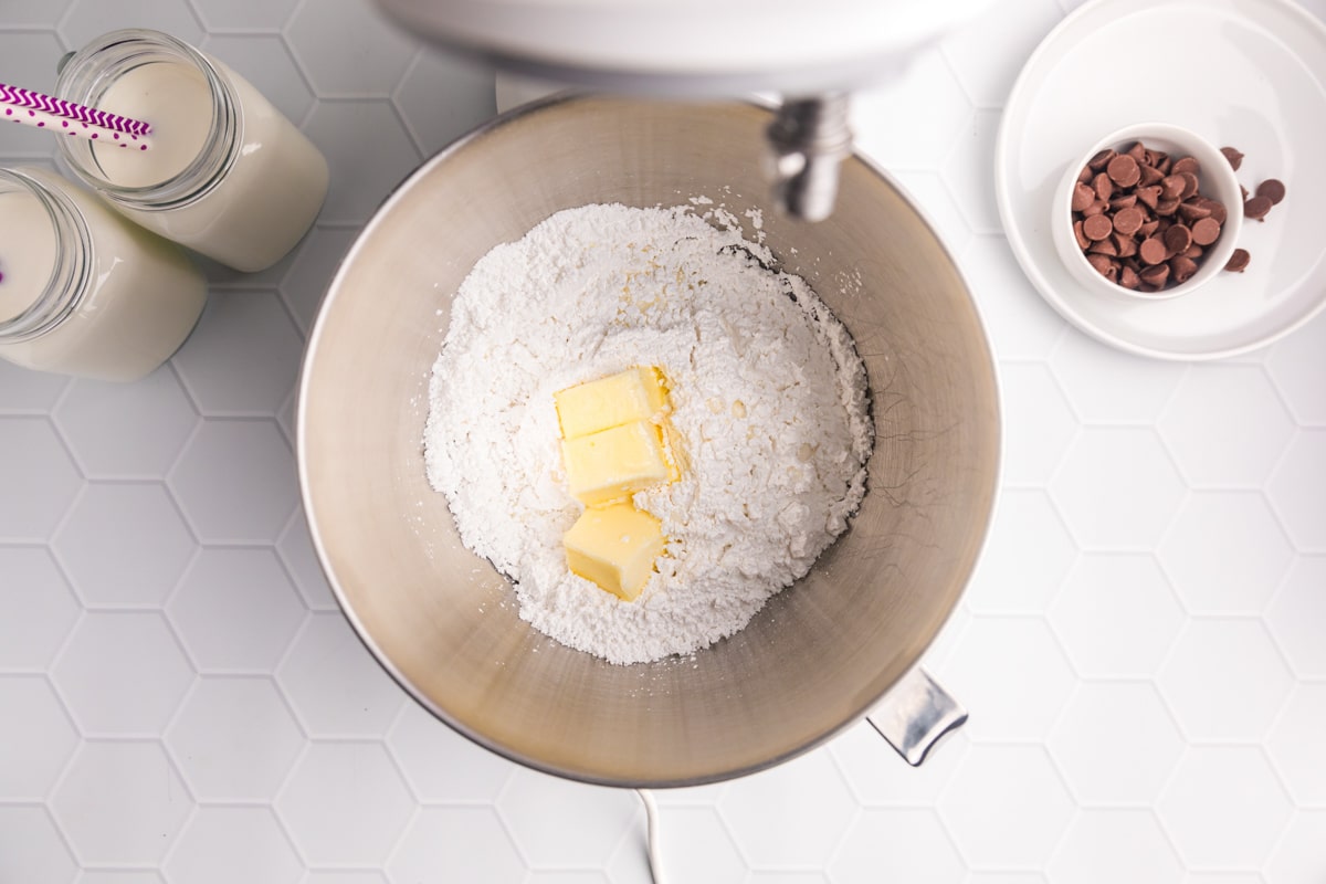 ingredients for buttercream frosting in a stand mixer bowl