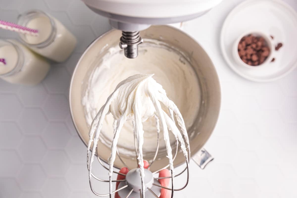 buttercream frosting on a whisk