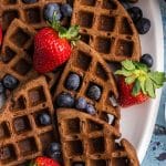 closeup of a plate of waffles with fresh berries
