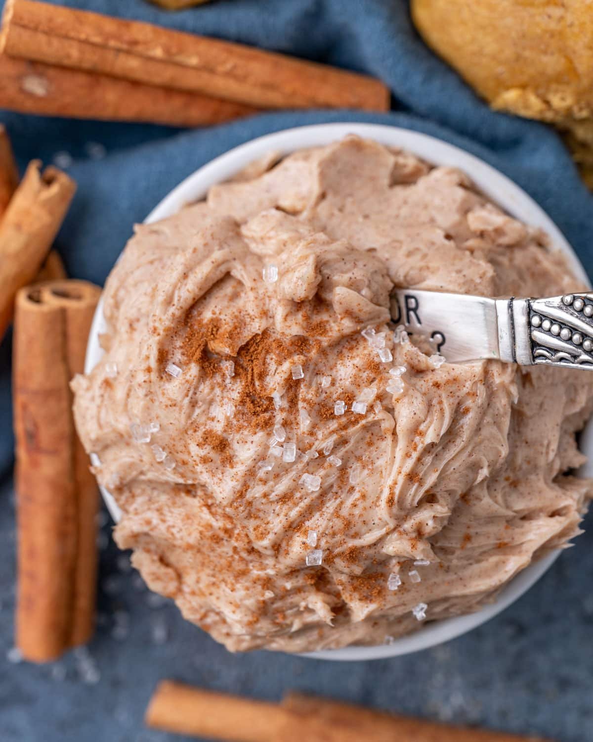 cinnamon butter in a bowl with a little knife