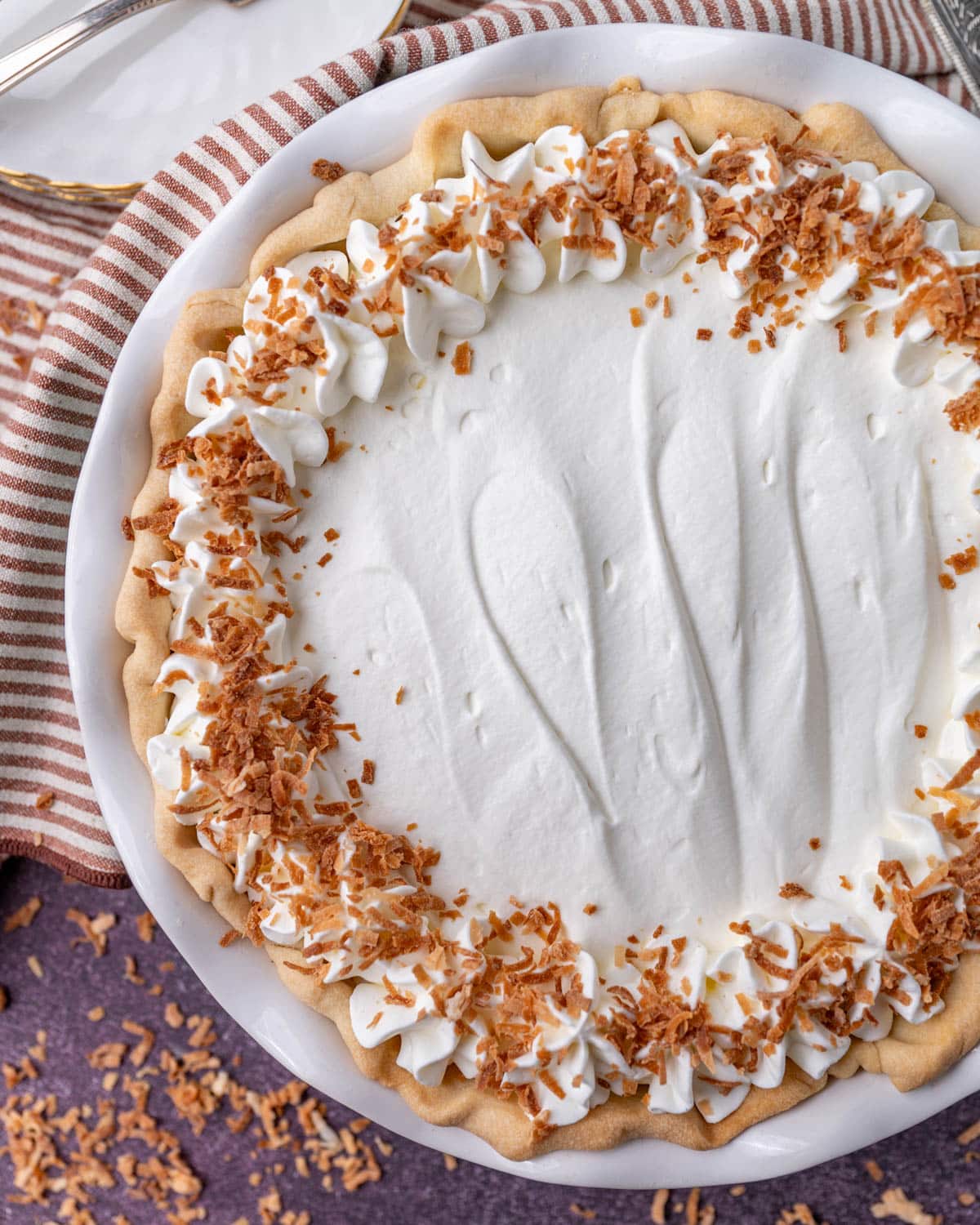 overhead view of coconut cream pie with toasted coconut on top