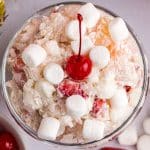 overhead view of glorified rice with marshmallows and a cherry on top