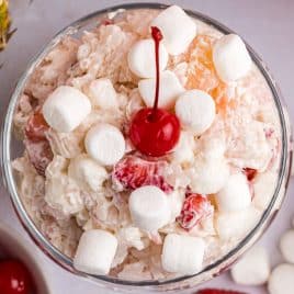 overhead view of glorified rice with marshmallows and a cherry on top