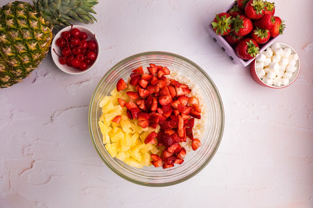 pineapple, strawberries and rice in a glass bowl