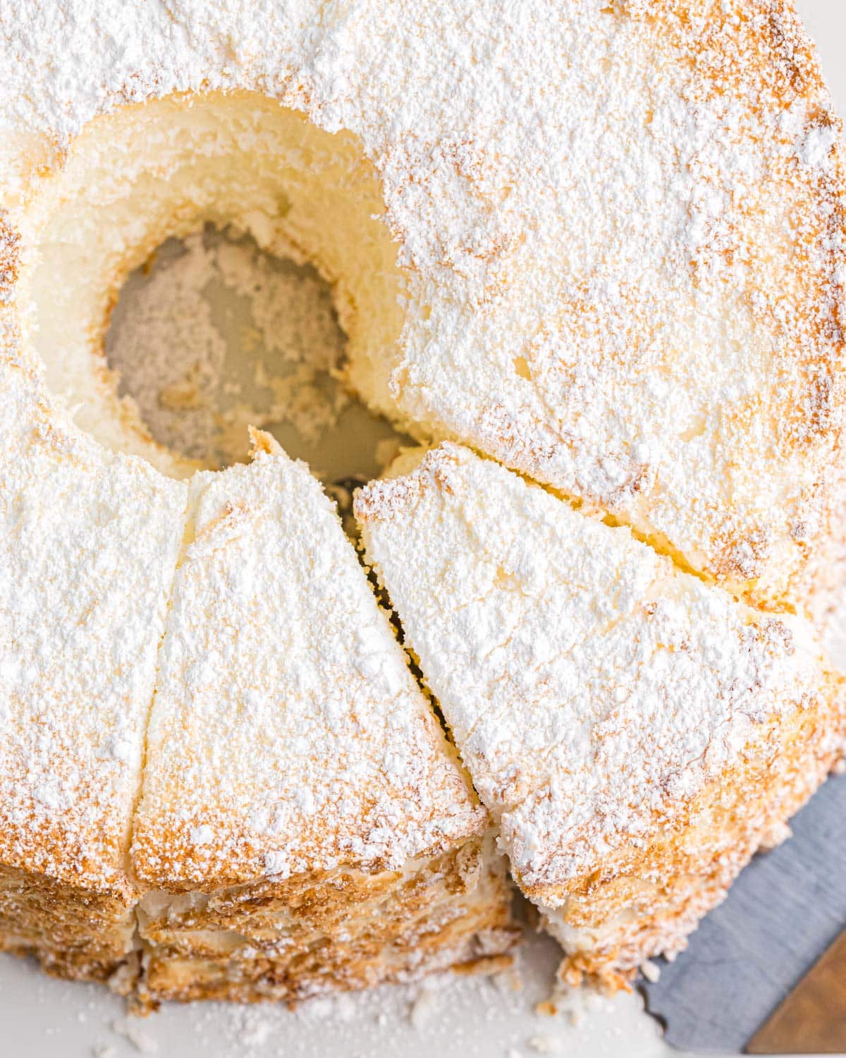 overhead view of angel food cake with powdered sugar dusted on top