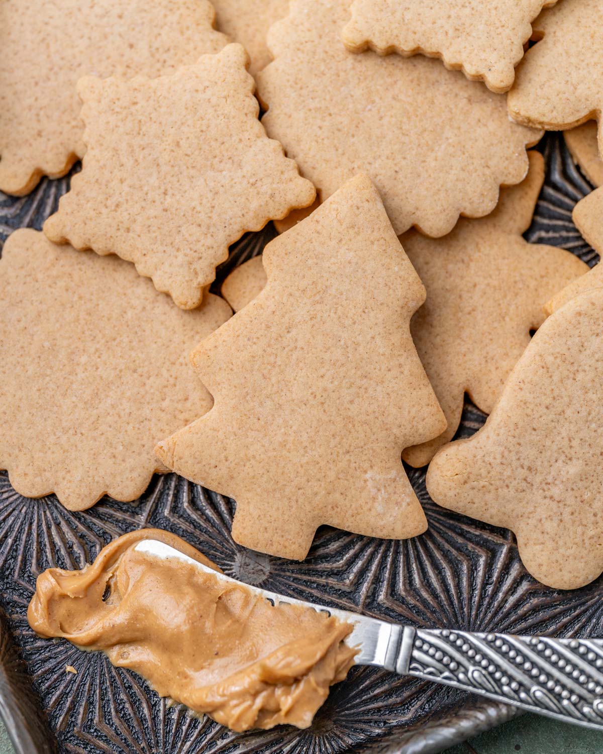 cut out peanut butter cookies on a baking pan