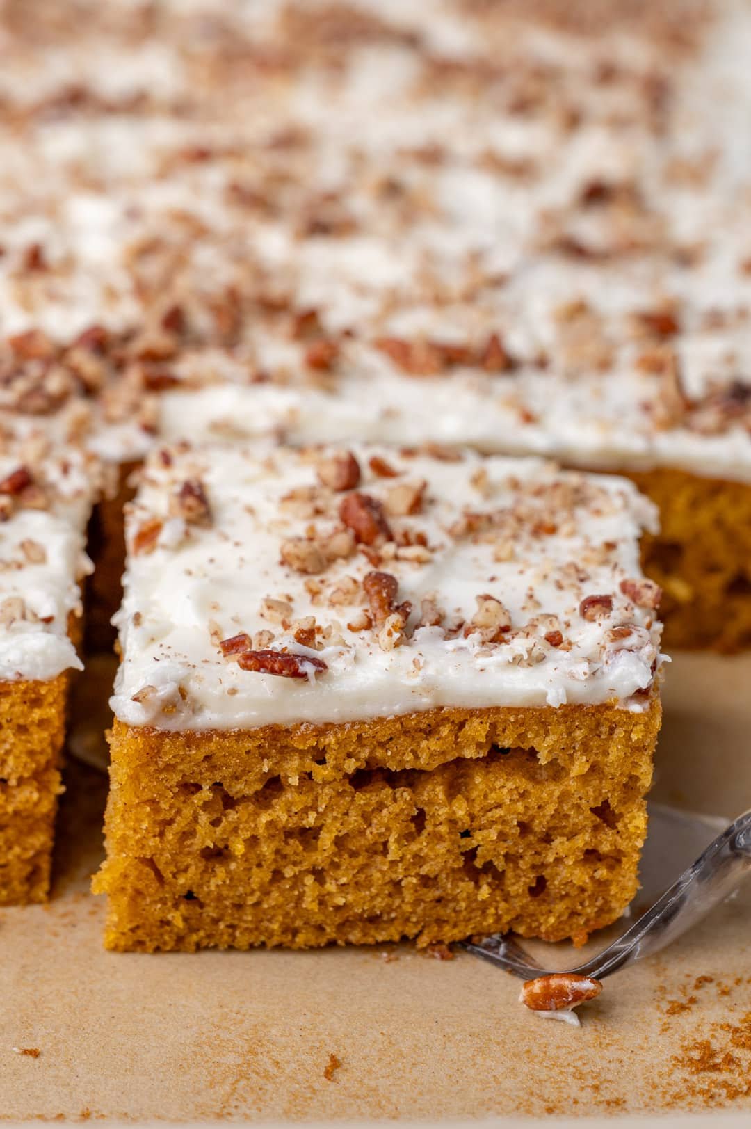 paula deen pumpkin bars in a pan with one bar on a spatula