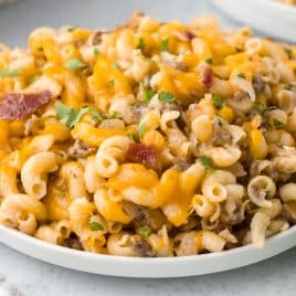 cheesy macaroni casaserole with bacon on a plate