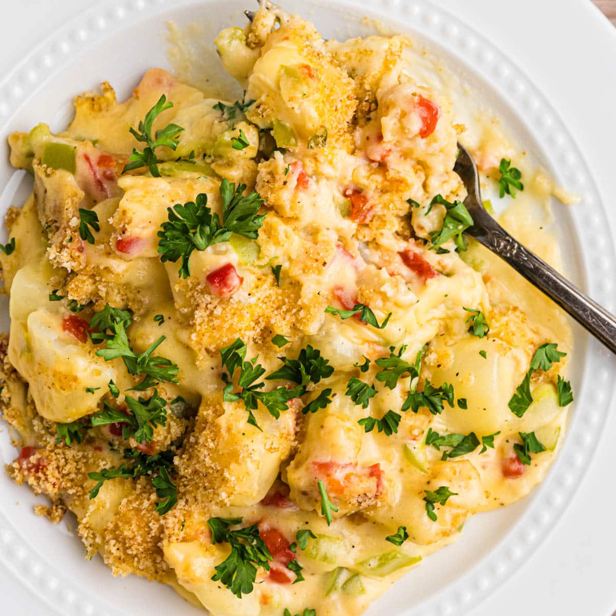 a plate of cheesy christmas potatoes