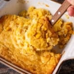 a scoop of corn casserole on a spatula
