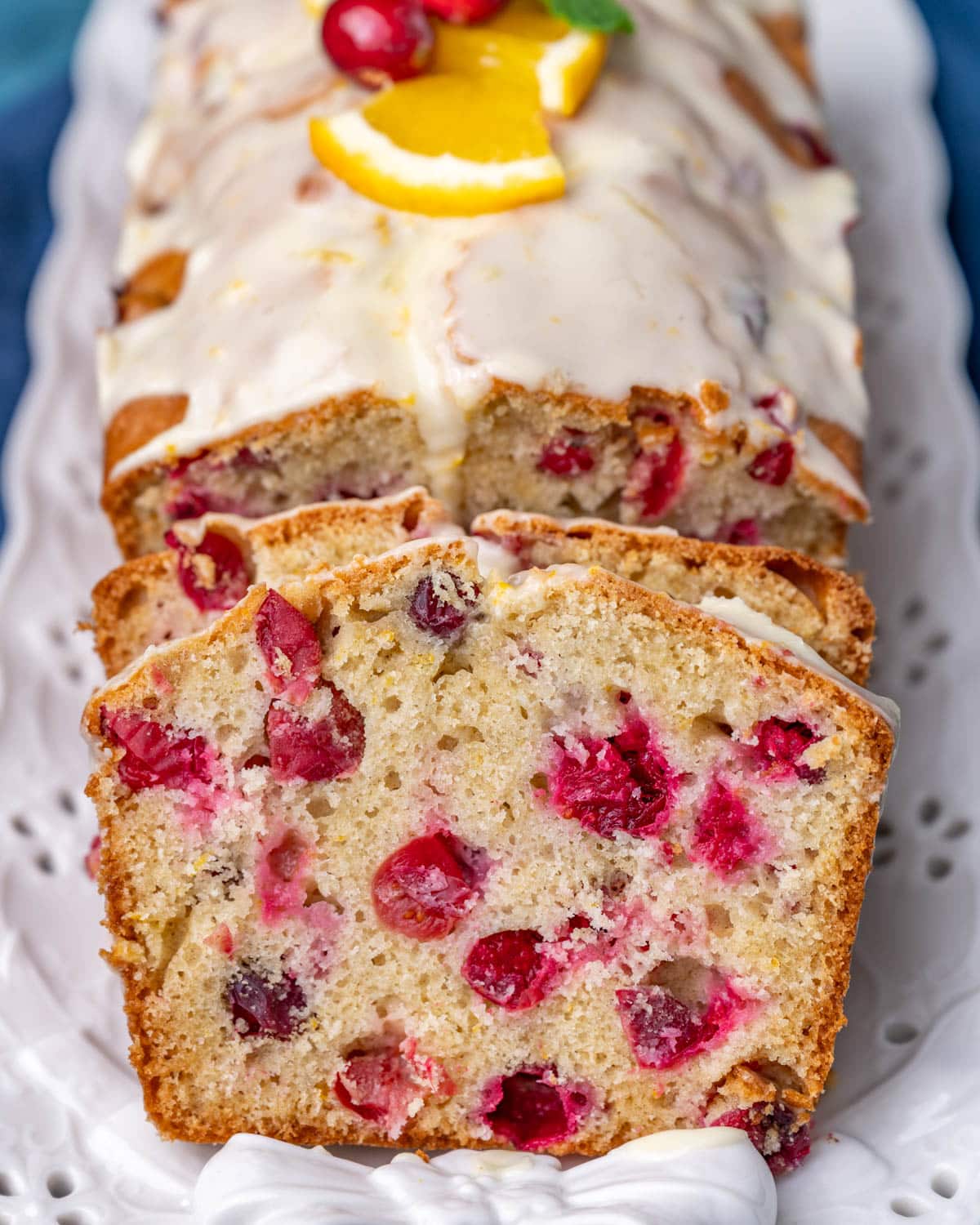 a loaf of cranberry orange bread on a plate