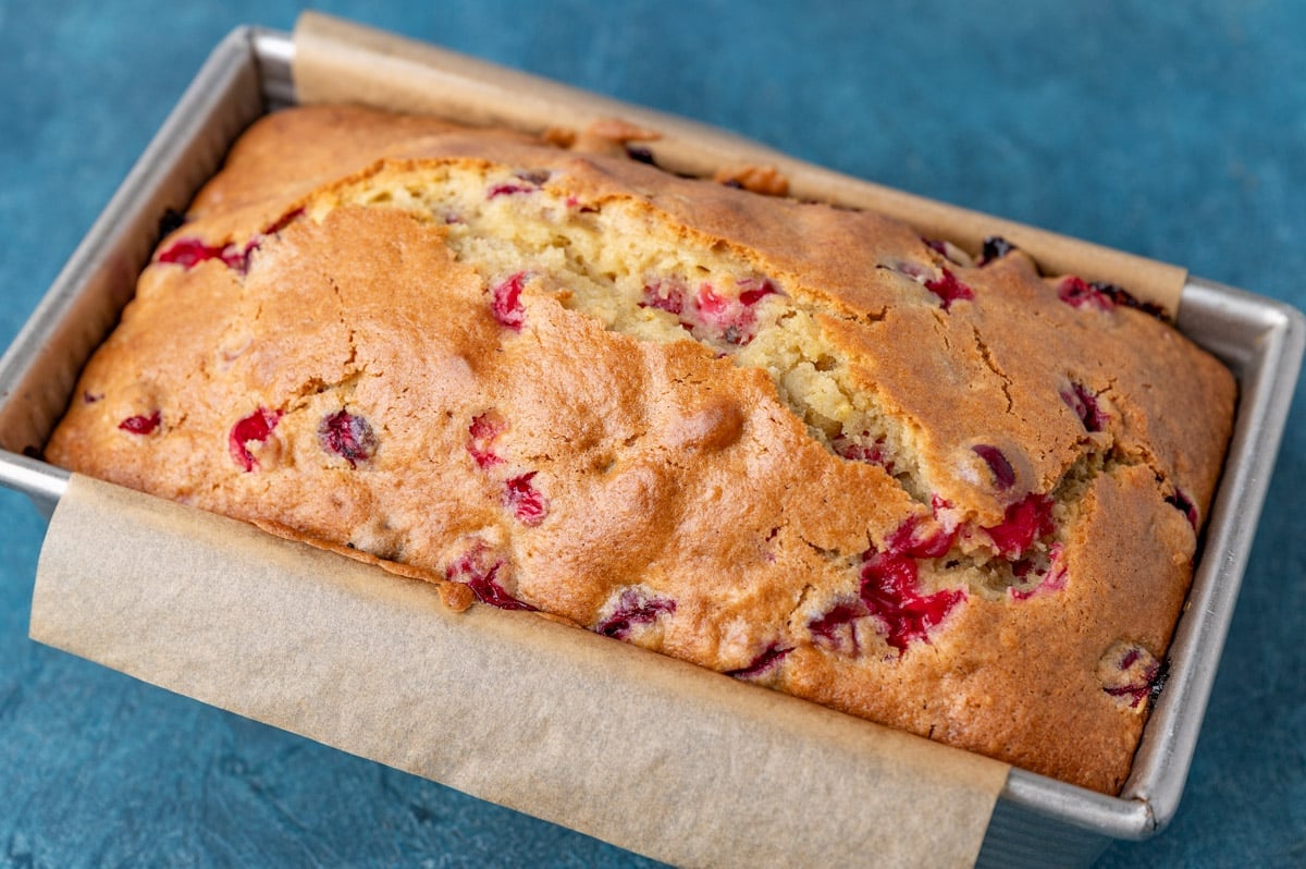 a loaf of cranberry orange bread in a pan