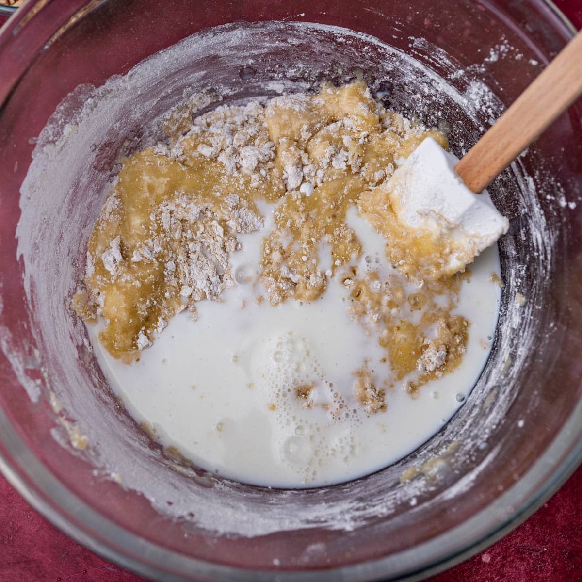 mixing in buttermilk and flour to quick bread batter