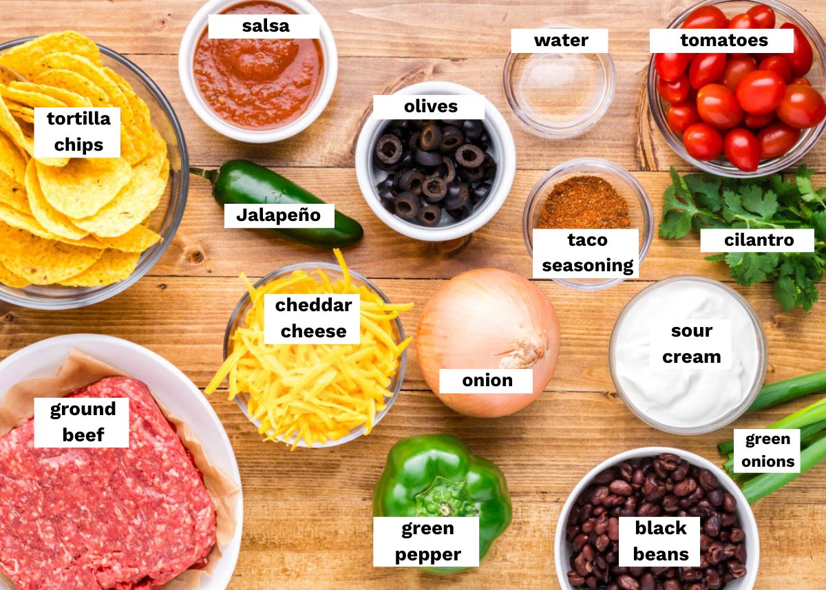 ingredients for beef nachos on a table