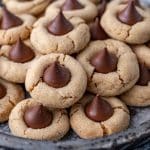 a plate of peanut blossoms cookies