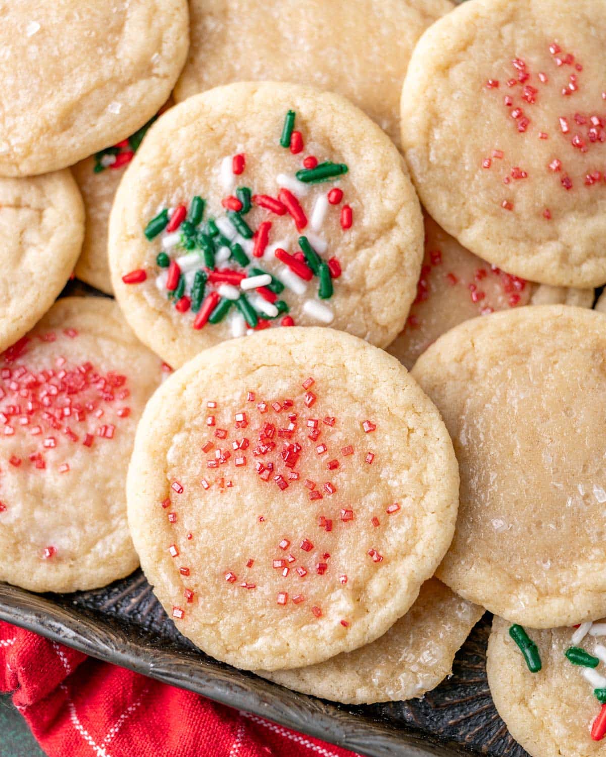 a pile of christmas sugar cookies on a plate