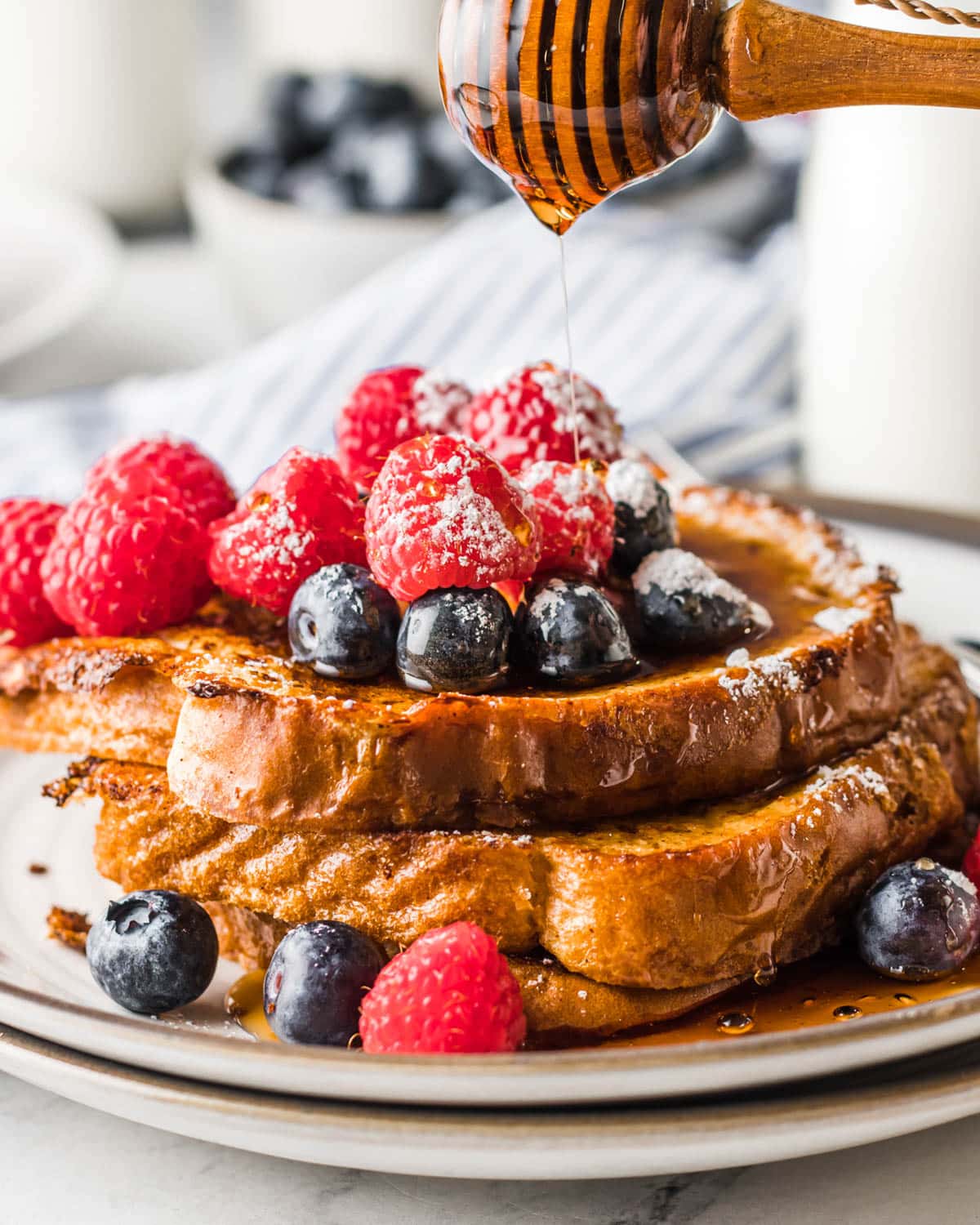 syrup dripping on fruit topped french toast