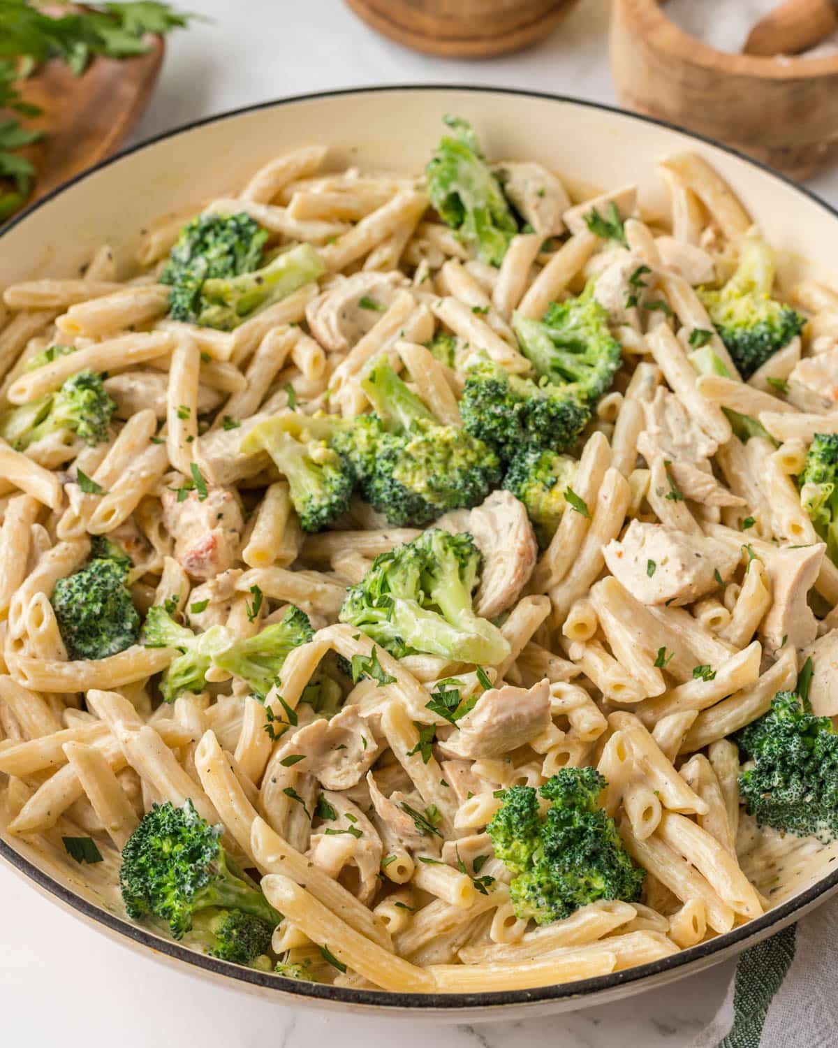cream chicken and broccoli pasta in a skillet