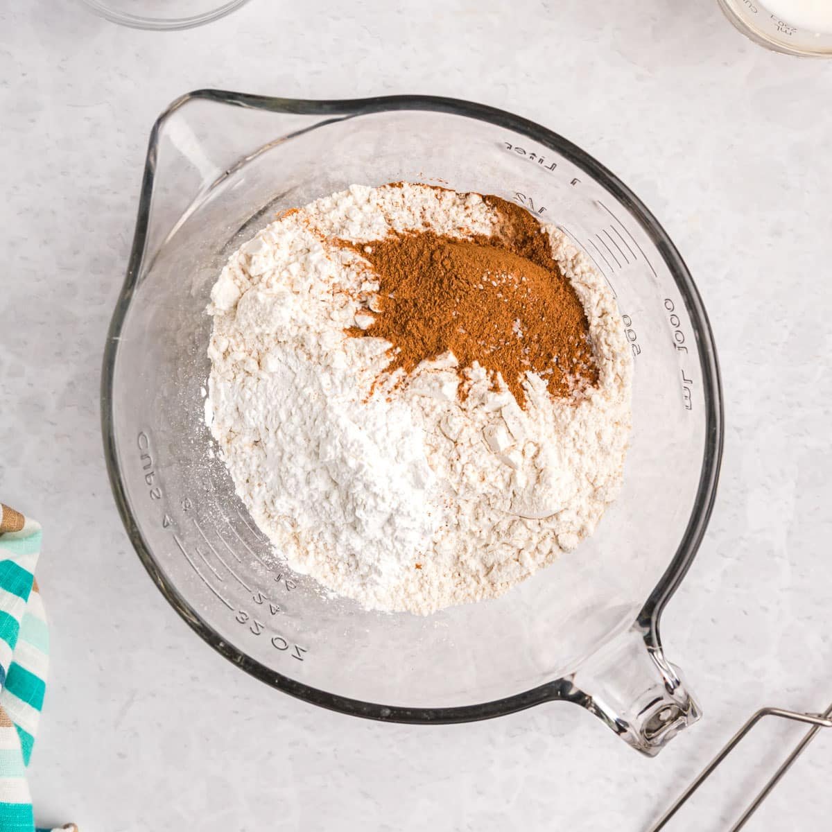 dry ingredients for muffins in a glass mixing bowl