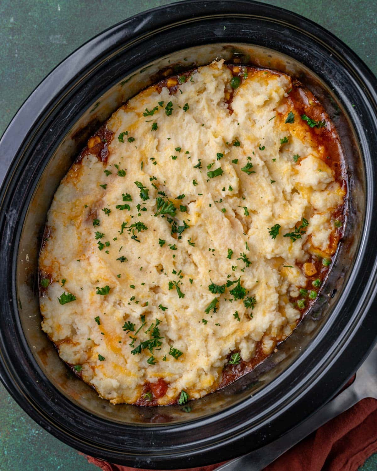 slow cooker shepherds pie with fresh parsley on top