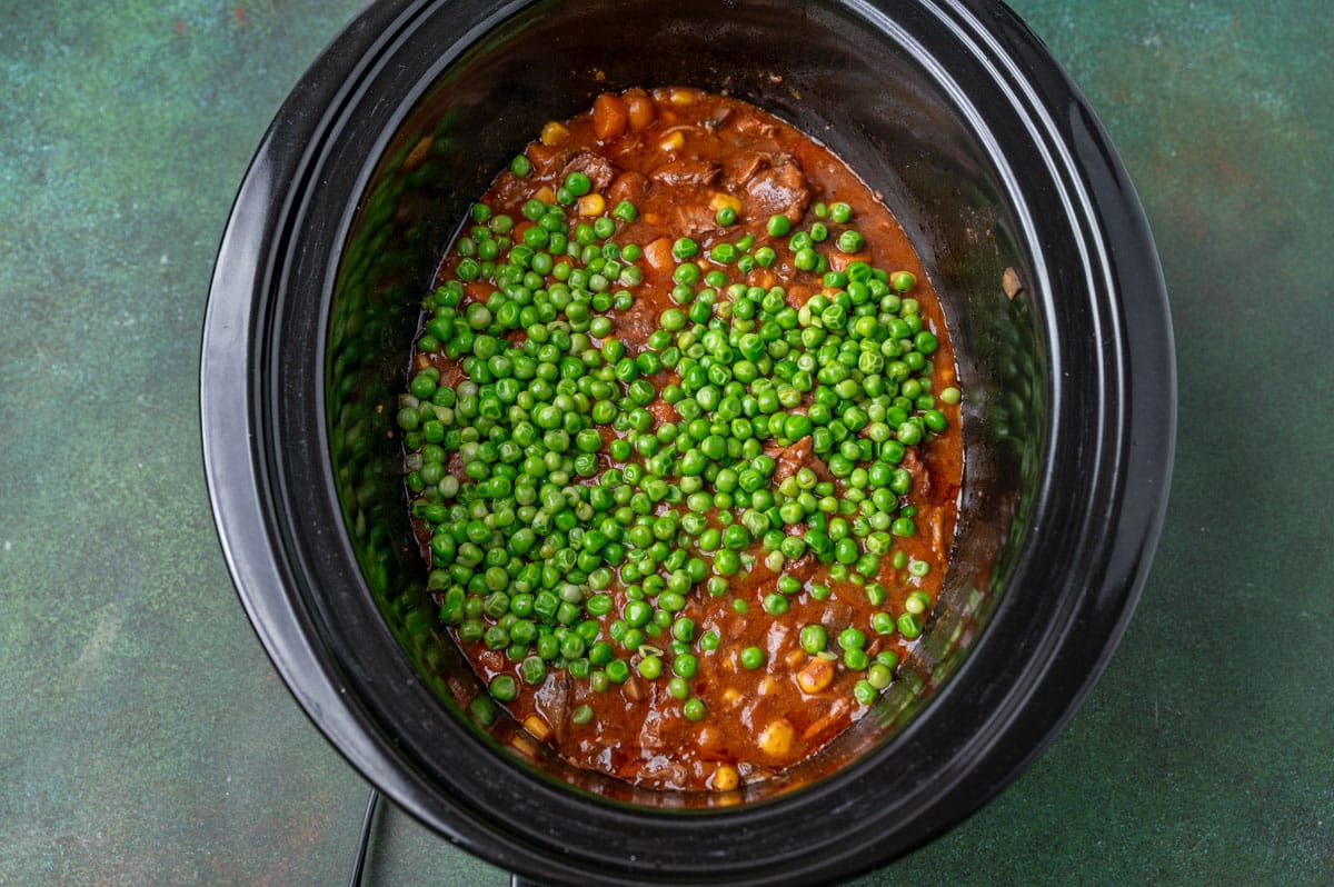 peas over roast beef in a slow cooker