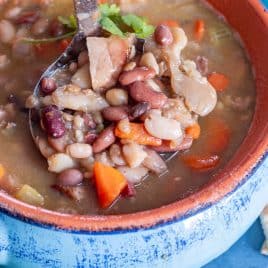 ham bone soup with hambeens on a ladle